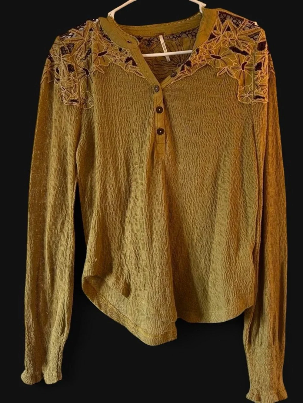 Free People embroidered henley long sleeve thermal top in an earthy green tone